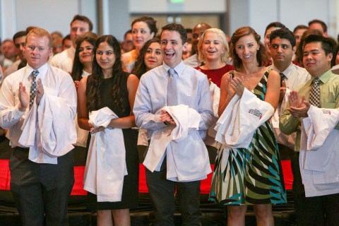 Students applaud during the inaugural White Coat Ceremony for the Doctor of Osteopathic Medicine Program at the University of the Incarnate Word.
